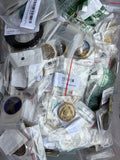 Assorted packaged recovery medallions, butterfly and triangle coins