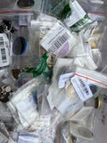 Mixed rainbow, purple and gold sobriety chips in individual bags
